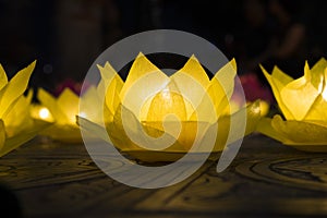 Flower garlands and colored lanterns for celebrating Buddha`s birthday in Eastern culture. They are made from cut paper and candl