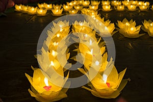 Flower garlands and colored lanterns for celebrating Buddha`s birthday in Eastern culture. They are made from cut paper and candl