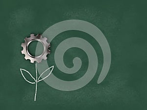 Flower gear wheel on chalkboard