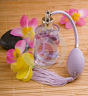 Flower and glass perfume bottle