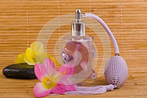 Flower and glass perfume bottle