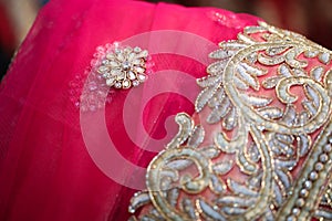 Flower motif on Pink colored lehenga with embroidery work