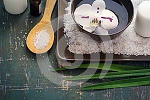 Flower orchids in bowl of water and SPA setting.