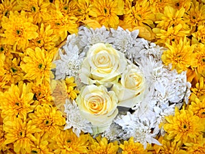 Flower ornament, white roses and yellow chrysanths