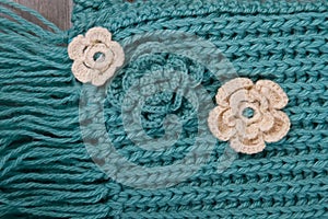 Flower ornaments on turquoise scarf