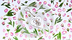 Flower pattern on a white background. Petals and buds of roses. In the center is a stand for rings in the shape of a heart