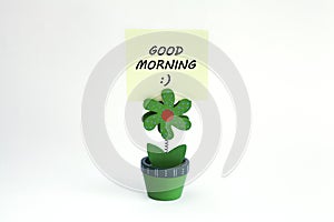 Flower photo clip with good morning message written on post it photo