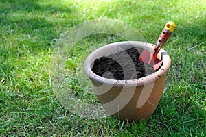 Flower pot filled with compost soil