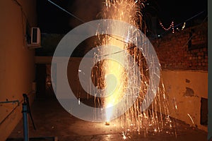 A Flower Pot fire cracker is mostly burnt on the night of Diwali releasing a spectacular outburst of sparkles