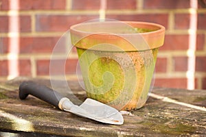 Flower pot and garden trowel