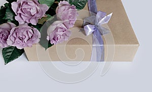 Flower rose pink violet purple gift box ribbon white background