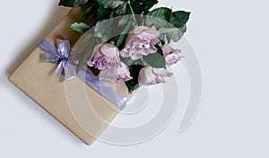 Flower rose pink violet purple gift box ribbon white background