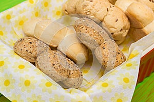 Flower shaped bread rolls in colorful paper napkins