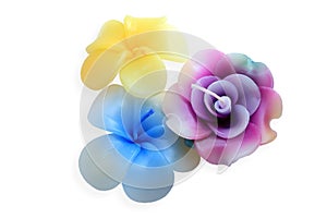 Flower shaped candles on white background with clipping path.