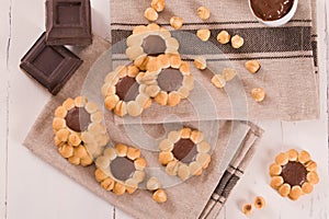 Flower shaped chocolate biscuits.