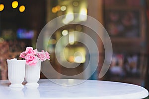 Flower with tables in coffee shop , bokeh background