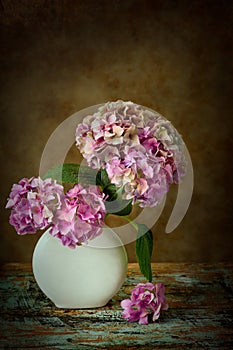 Flower vase on textured backdrop