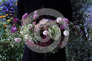 Flower wedding arrangement with ranunculus, pion, roses