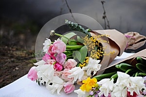 Flower wedding arrangement with ranunculus, pion, roses photo