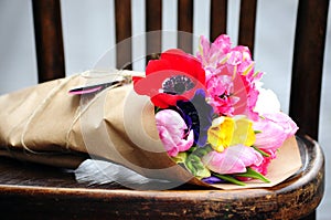 Flower wedding arrangement with ranunculus, pion, roses photo