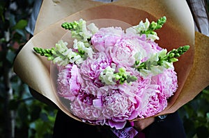 Flower wedding arrangement with ranunculus, pion, roses photo