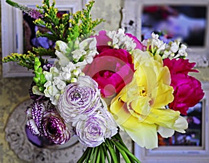 Flower wedding arrangement with ranunculus, pion, roses photo