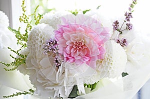 Flower wedding arrangement with ranunculus, pion, roses photo