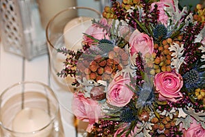 Flower wedding bouquet with candles photo