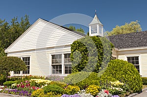 Flowerbed around building photo