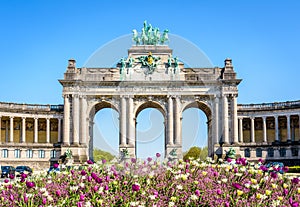 A flowerbed in front of the arcade du Cinquantenaire on a sunny spring day in Brussels, Belgium
