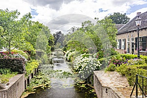 The flowered Herengracht in the picturesque village of Drimmelen, Netherlands