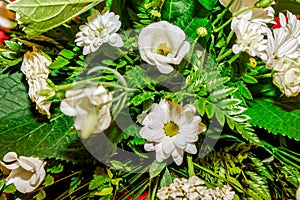 Floral decoration with daisies and white eustoma with green background. Lisianthus. photo