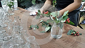 Flowers arranging on wooden table