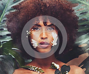 Flowers, art and portrait of black woman with beauty, skincare and creative or eco friendly cosmetics from nature