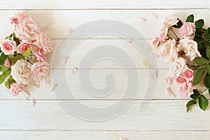 Flowers background . Bouquet of beautiful pink roses on white wooden background.