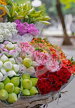 Flowers in baskets appear to be neatly arranged to be sold photo