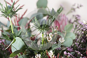 Flowers bouquet with Eryngium alpinum, alpine sea holly flower