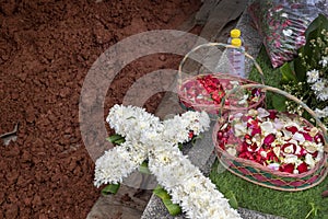 Flowers bouquet lying on the grave