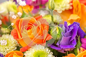 Flowers bouquet with orange rose, close up