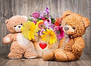 Flowers in the box and teddy bears