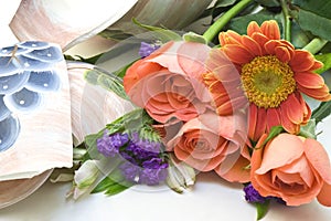 Flowers and broken vase