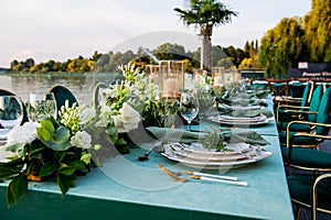 Flowers. Candles. Sunset. Wedding decoration. Floral arrangements