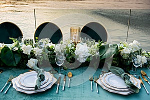 Flowers. Candles. Sunset. Wedding decoration. Floral arrangements