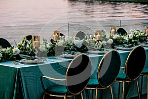 Flowers. Candles. Sunset. Wedding decoration. Floral arrangements