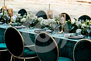 Flowers. Candles. Sunset. Wedding decoration. Floral arrangements