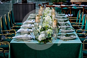 Flowers. Candles. Sunset. Wedding decoration. Floral arrangements