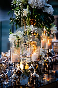 Flowers. Candles. Sunset. Wedding decoration. Floral arrangements