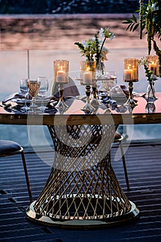 Flowers. Candles. Sunset. Wedding decoration. Floral arrangements