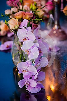 Flowers. Candles. Sunset. Wedding decoration. Floral arrangements