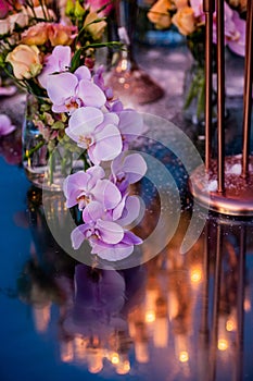 Flowers. Candles. Sunset. Wedding decoration. Floral arrangements